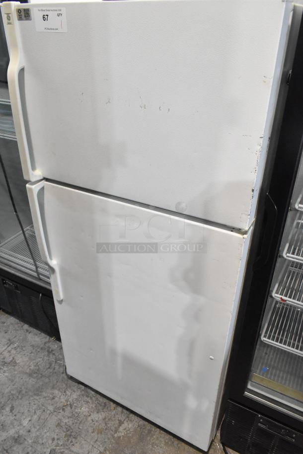General Electric GE STS16ABSARWW reach-in cooler with freezer, white, 115 volts, 1 phase, visible wear on exterior.