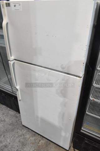 General Electric GE STS16ABSARWW reach-in cooler with freezer, white, 115 volts, 1 phase, visible wear on exterior.