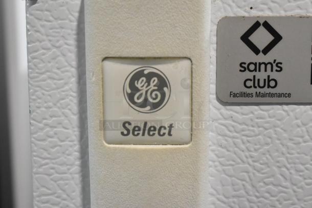 General Electric STS16ABSARWW cooler and freezer, features a "GE Select" button and Sam's Club maintenance label.
