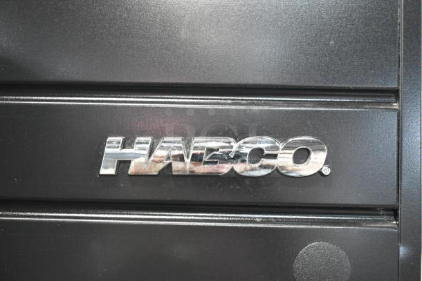 2019 Habco SE18 metal commercial cooler, single door, poly-coated racks. Logo visible on black surface. 115V, 1 Phase.