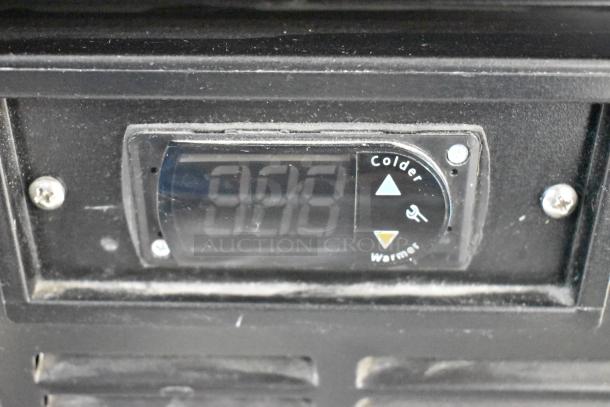 Control panel of 2019 Habco SE18 Reach In Cooler, showing temperature adjustment buttons and display.