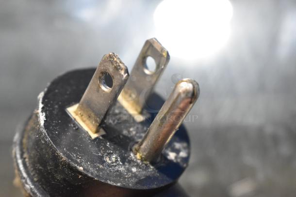 Close-up of metal prongs on a plug of a Beverage Air CDR5/1-W-20 Deli Display Case. Features slight wear.