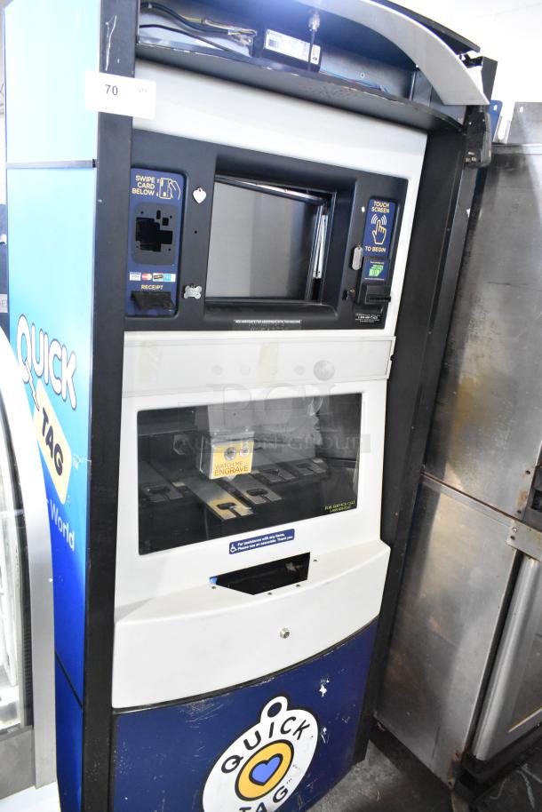 Metal commercial floor-style animal tag engraving machine with card slot and touchscreen interface. Signs of wear visible.