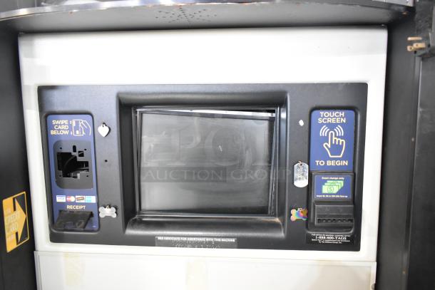 Metal commercial floor-style animal tag engraving machine with touch screen, card slot, and cash input; used condition.