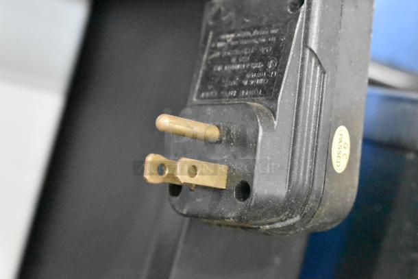 Metal commercial floor-style animal tag engraving machine plug showing O.C.C. passed sticker.