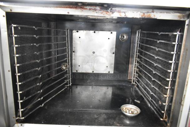Vulcan stainless steel commercial convection oven interior, view-through doors, metal racks, thermostatic controls, used condition.
