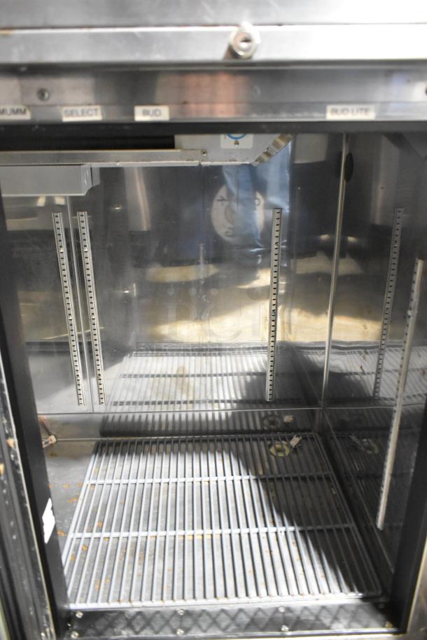 Perlick BS60 Metal Commercial 2 Door Back Bar Cooler. Signs of wear, dual shelving slots, 115 volts, 1 phase.