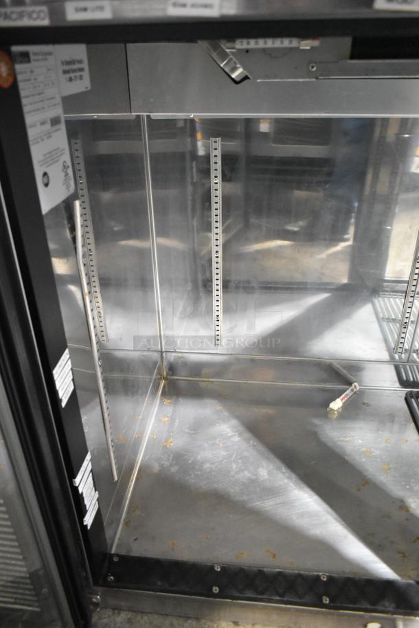 Perlick BS60 metal commercial 2-door back bar cooler, 115V, 1-phase, visible interior shelving tracks, moderate wear.