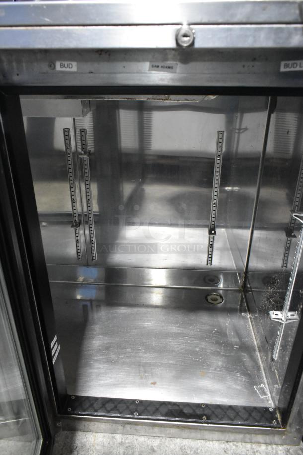 Perlick BS60 metal commercial cooler, 2-door, visible shelving, 115 volts, 1 phase, fair condition with interior markings.