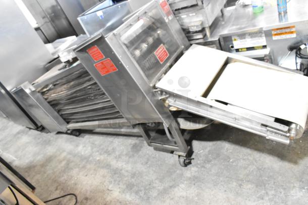 Superior 5186INF Metal Commercial Floor Tortilla Cooling Conveyor, 230V, 1 Phase. Features red warning labels, casters for mobility.
