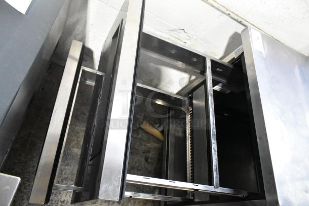 Turbo Air TPR-67SD-D4 stainless steel pizza prep table with four open drawers, commercial-grade, 115V, 1 phase.