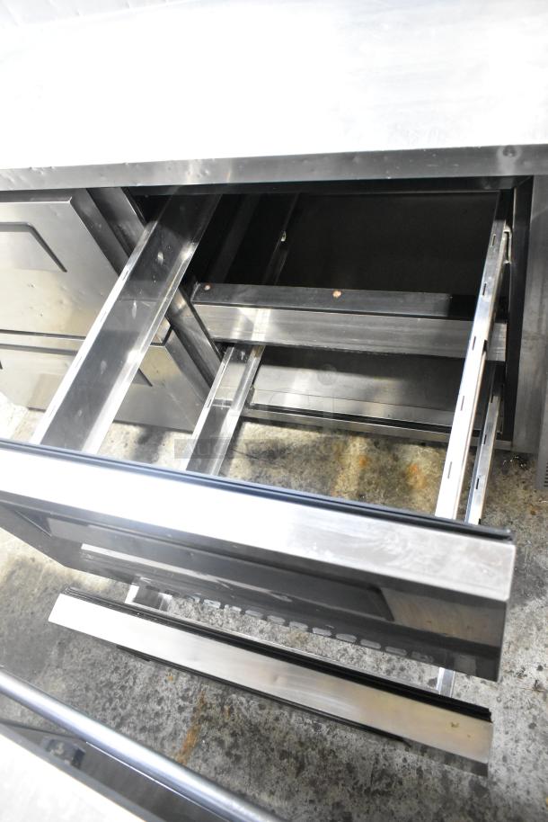 Turbo Air TPR-67SD-D4 stainless steel pizza prep table with 4 drawers, 115V, commercial use, excellent condition.