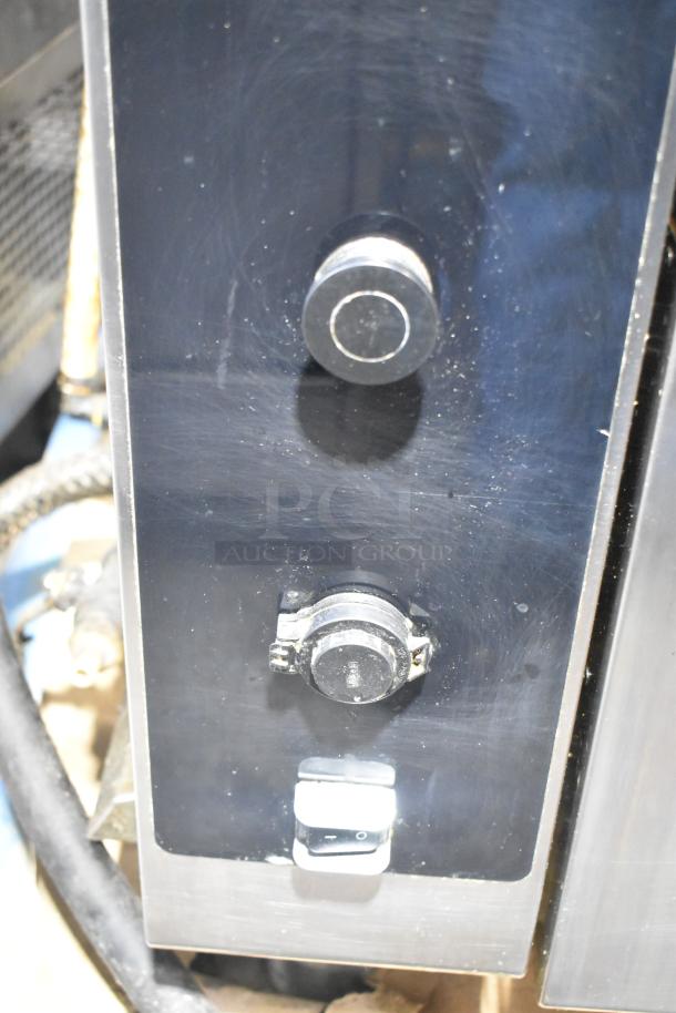 2 Alto Shaam AR-7T rotisserie ovens, stainless steel, electric, self-cleaning, 208V, 1 phase, feature control knobs.