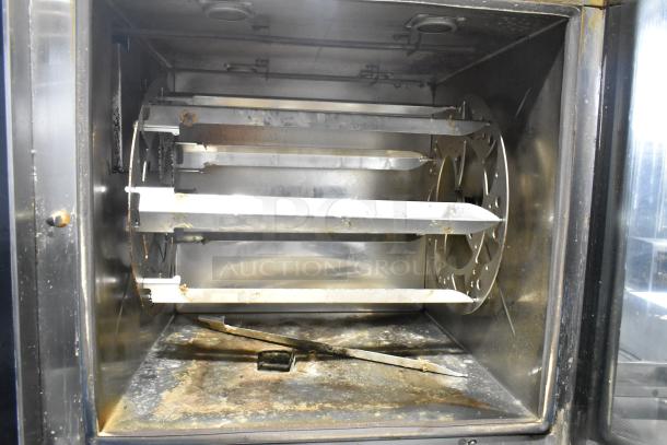 2 Alto Shaam AR-7T electric rotisserie ovens, stainless steel, self-cleaning, 208V, 1 phase, moderate wear.