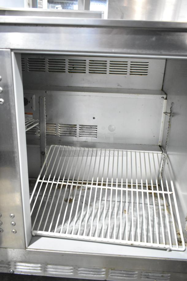Beverage Air UCR48A stainless steel commercial 2-door undercounter cooler, interior view, with shelves, 115V, 1 phase.