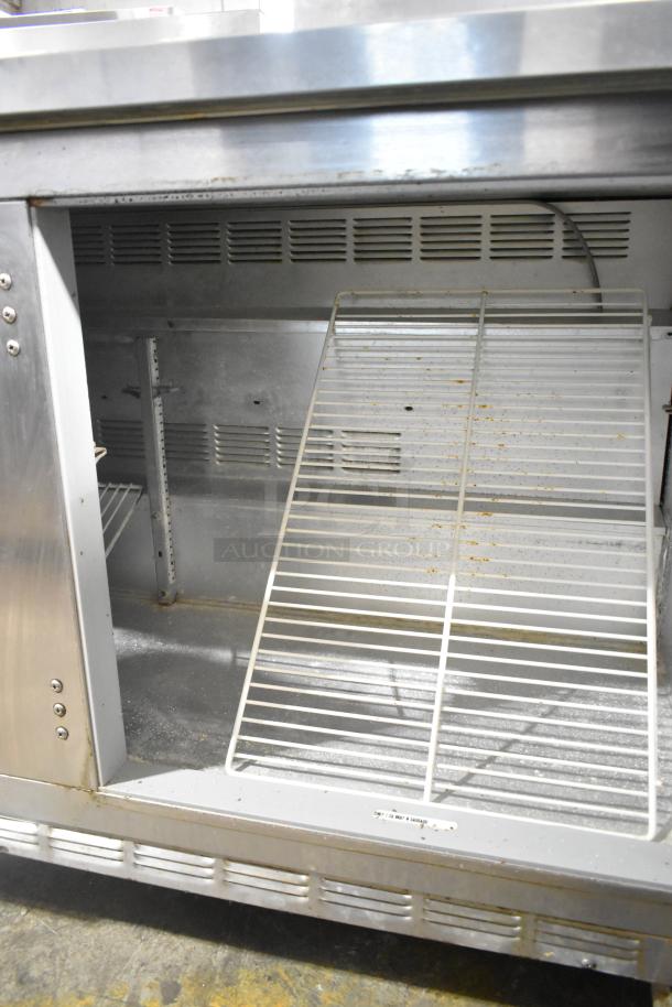 Beverage Air WTR60A stainless steel 2-door undercounter cooler on casters, interior view with shelving, 115V, pre-owned.