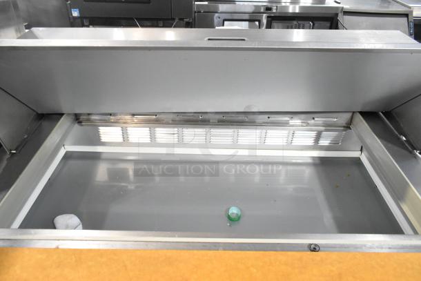 Beverage Air stainless steel sandwich salad prep table, commercial-grade with Mega Top, 115V, on casters.