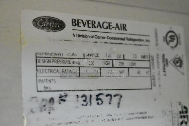 Beverage Air stainless steel commercial sandwich salad prep table label shows refrigerant and electrical ratings.