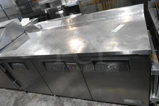 True TWT-72 stainless steel commercial 3-door work top cooler, 115 volts, 1 phase, good condition, visible branding label.