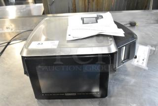 Hobart metal commercial countertop scale with digital display. Compatible with 120/208-240 Volts, 1 Phase. User manual included.