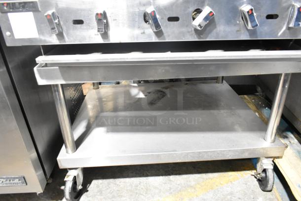 Vulcan VACB36-101 stainless steel natural gas charbroiler grill on stand with casters, 102,000 BTU, visible control knobs.