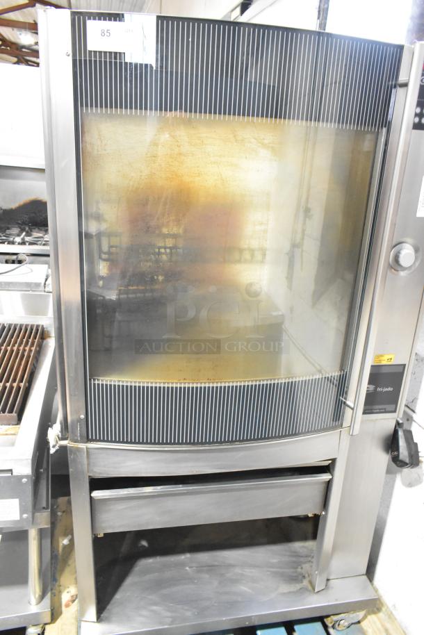 Fri-jado STG7-P stainless steel rotisserie oven on casters. Features electric power, 208V, 3-phase, with visible control panel.