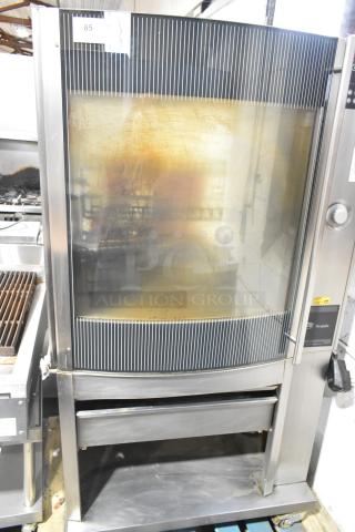 Fri-jado STG7-P stainless steel rotisserie oven on casters. Features electric power, 208V, 3-phase, with visible control panel.