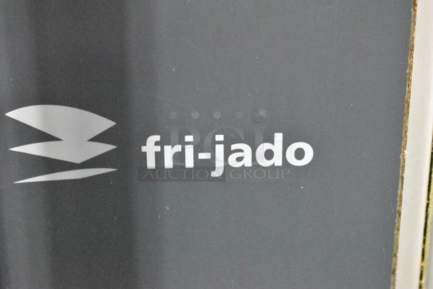 Fri-jado logo detailing on a commercial rotisserie oven. Model STG7-P, stainless steel, electric, 208V, 3 phase.