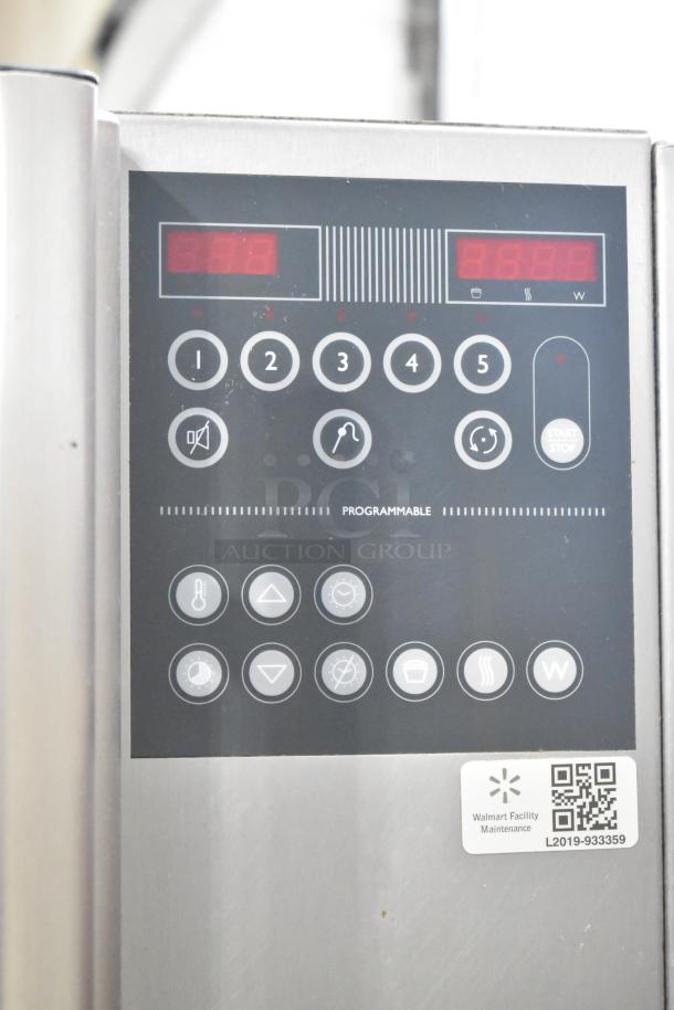 Fri-jado STG7-P stainless steel rotisserie oven control panel, showing buttons and display, on commercial casters.