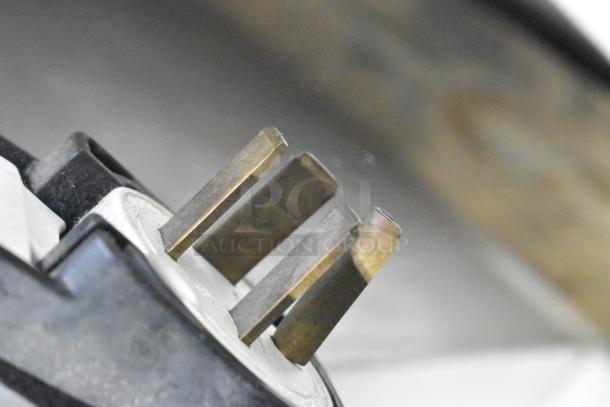 Close-up of Fri-jado STG7-P rotisserie oven plug showing prongs, suitable for 208 volts, 3-phase connection.