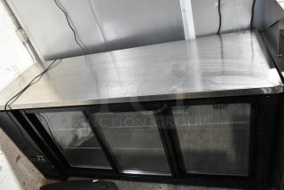 Avantco 178UBB72SHC 3-door back bar cooler, metal finish, good condition, 115V, 1 phase, model label visible.