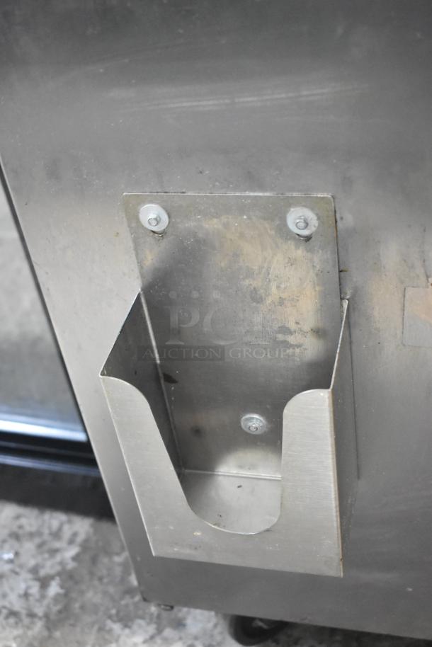 Beverage Air SPE48-18M-HMP stainless steel prep table with commercial casters. Features 115 volts, 1 phase power supply.