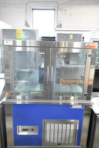 Piper Products 4-OTR-2 stainless steel cold food display case, commercial grade, 208 volts, dual doors, clear glass front.