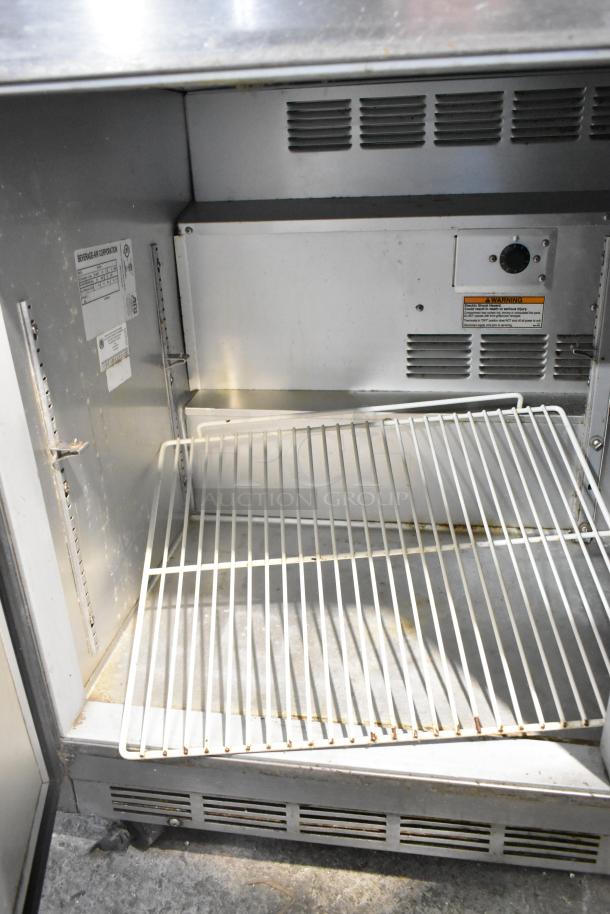 Beverage Air UCR48A stainless steel 2-door undercounter cooler, 115V, 1-phase. Interior view showing shelves and label details.