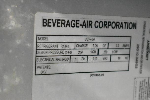 Beverage Air UCR48A stainless steel undercounter cooler, 2-door, 115V, 1 phase, model label showing specs and refrigerant info.
