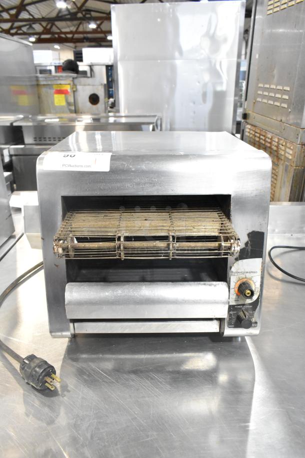 Star Holman stainless steel commercial conveyor toaster oven, 120 volts, 1 phase, with visible control dials and power cord.