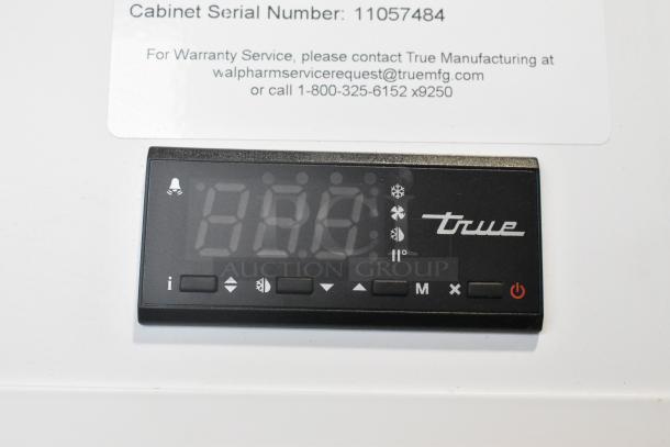 Digital control panel of True TSCI-600R-G-PH cooler, showing temperature indicators and brand logo. Serial number: 11057484.