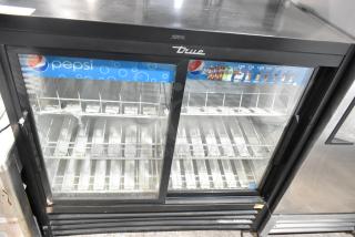 True GDM-41SL-48-HC-LD 2-door cooler merchandiser with glass doors and poly-coated racks, 115V, 1 Phase, good condition.