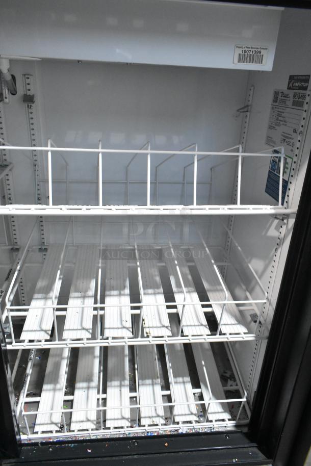 True GDM-41SL-48-HC-LD commercial cooler, 2-door, metal, with poly-coated racks. Condition: Used, with 115 Volts, 1 Phase.