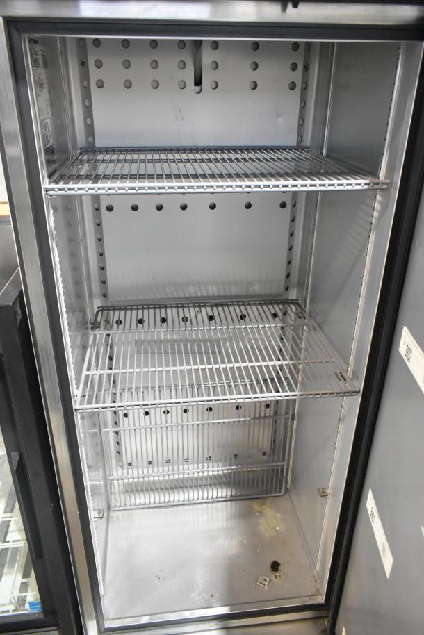 True T-19F-HC stainless steel commercial single door reach-in freezer with poly coated racks, 115V, excellent condition.