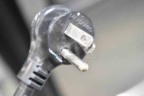 Close-up of a power plug for a True T-19F-HC Reach-In Freezer, 115 Volts, 1 Phase.