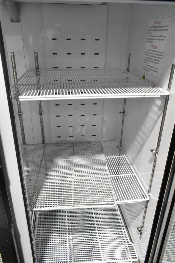 2021 Blue Air BKGM49-HC 2 Door Reach In Cooler, metal with poly coated racks, 115V, 1 phase, interior view.