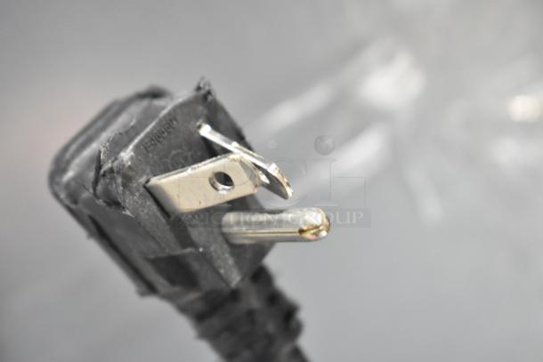 Close-up of a power plug for a 2021 Blue Air BKGM49-HC Cooler Merchandiser, showing prongs and cord condition.