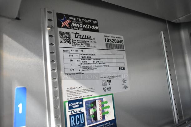 2022 True T-19F-HC stainless steel commercial freezer label showing model, voltage, and refrigerant details.