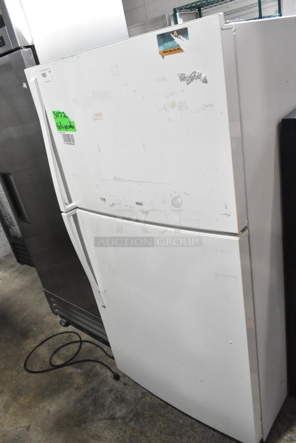 Whirlpool metal reach-in cooler with freezer, 115 volts, 1 phase. Visible wear, model label intact.