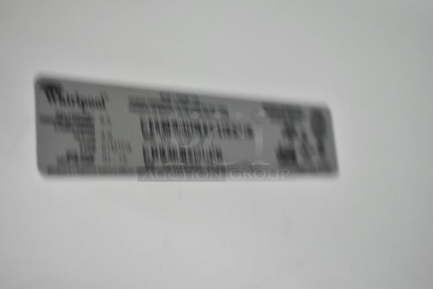 Blurry image of Whirlpool label on metal reach-in cooler with freezer. Model and specs not clearly visible. 115 Volts, 1 Phase.