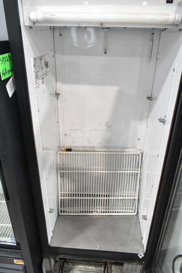 True GDM-12 metal commercial single door cooler, 115V, 1 phase, with poly coated racks, clean interior, intact seal.