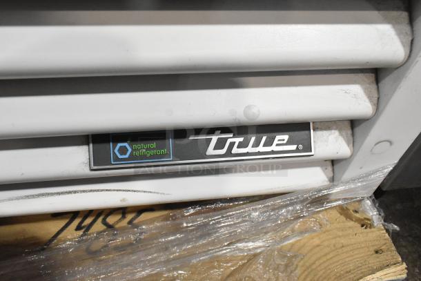 2021 True TSCI-600R-G-PH metal commercial cooler, single door, poly-coated racks, label notes natural refrigerant use.