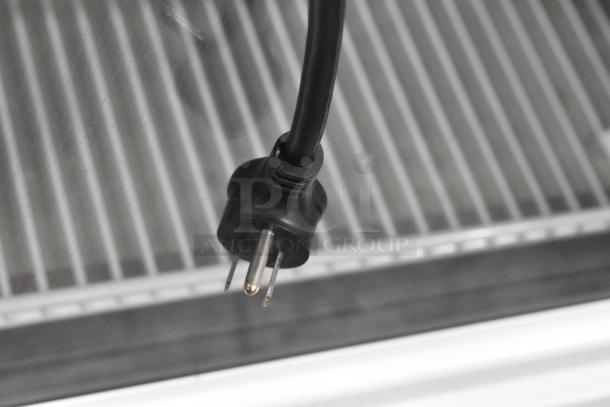 2021 True TSCI-600R-G-PH reach-in cooler plug, poly-coated racks visible. 115V, 1 phase. Clean condition.