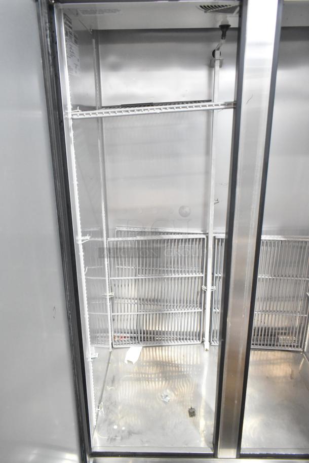 2018 True T-35-HC stainless steel commercial 2-door reach-in cooler with poly-coated racks, visible interior, 115 volts, 1 phase.